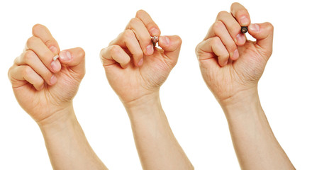 Hände mit Stift, Pinsel und Kuli