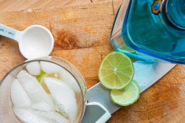 Alcoholic drinks with gin and tonic on a wood table background