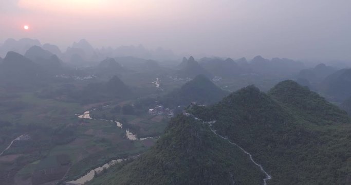 Beautiful aerial landscape of Guilin,Li River, karst mountains in Cuiping Village at sunset. Top view of area located in Yangshuo County,Guangxi Province,China.Travelling to unique destination concept