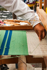 Weaver on loom