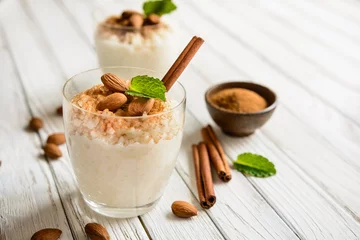 Foto op Plexiglas Creamy rice pudding topped with cinnamon and almond © noirchocolate