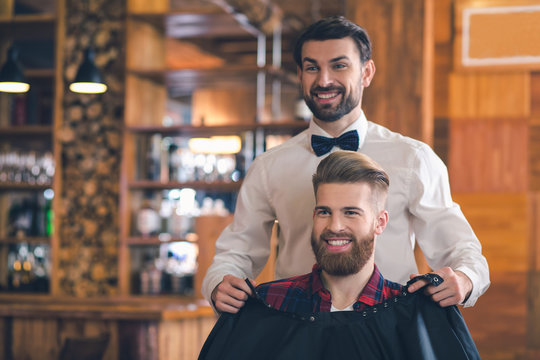 Young Man in Barbershop Hair Care Service Concept