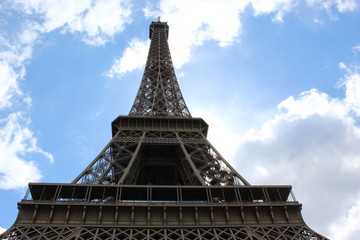 Eiffel Tower with blue sky and clouds