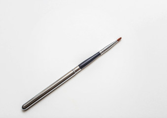 Brushes for make-up and precious stones.