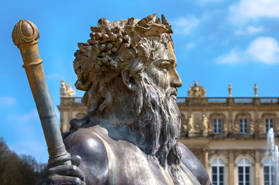Neptun statue on Baroque fountain.Detail of sculpture of Poseidon from the fountain of the Castle of Ludwig The Bavarian on Island Herreninsel,Chiemsee,Bavaria,German.