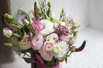 the Spring bouquet of pink Ranunculus, lisianthus and Veronica for a special wedding ceremony