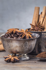 Coffee, coffee beans, coffee powder, aniseed, cinnamon, cup, bowl