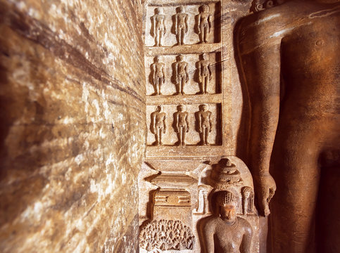 Carved architecture of India. Figurs of Jainism inside the 7th century cave temple, in town Badami, India