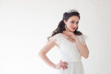 Princess with a Crown in white dress the bride