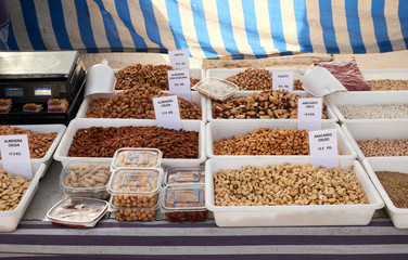 Many bags of various types of nuts for sale at Sunday market in Spain, Mercadillo de Campo de...