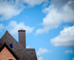 Part tiled roofs against the sky