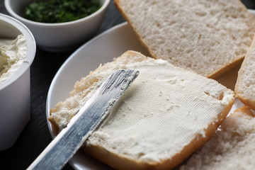 piece of white bread covered with curd cheese