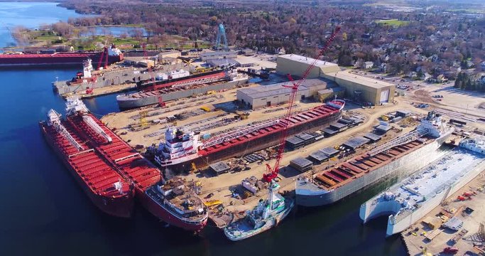 Beautiful industrial shipyard gleaming in the morning sun, aerial view.
