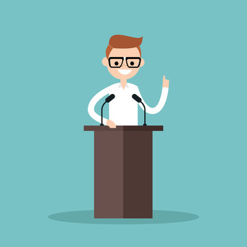 Nerd boy standing behind the tribune and pointing his finger up / flat editable vector illustration