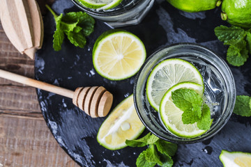 Mojito cocktail in a bur on a rustic table, selective focus