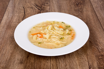Vegetable soup on a wooden table