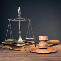 Law scales, judge gavel, old book. Symbol of justice