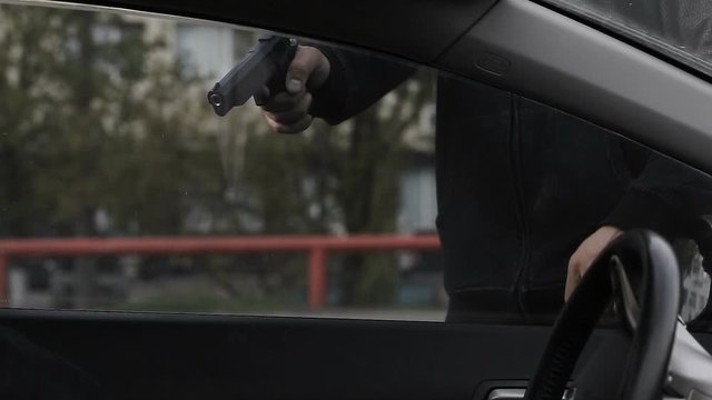 The criminal committed an armed robbery of the driver of the car. Threatening the guns took away a purse with money.