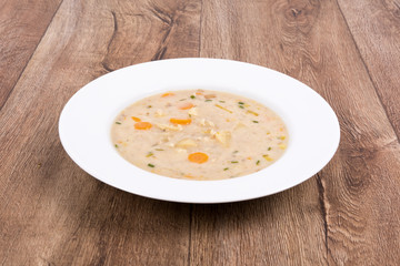 Vegetable soup on a wooden table