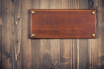Sign board blank on old vintage wooden wall background