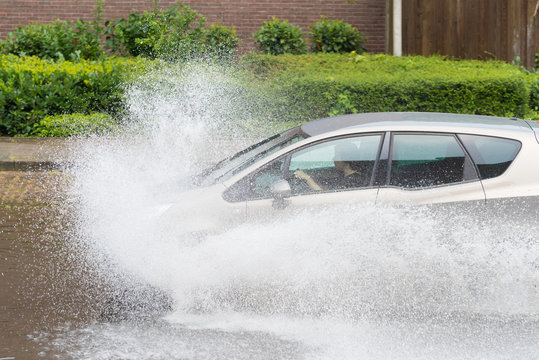 car in flooded street