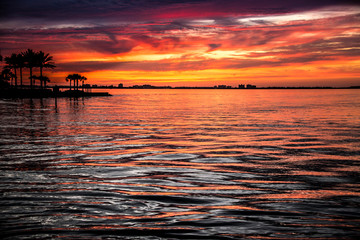 Sunset at sea colorful skies palm trees