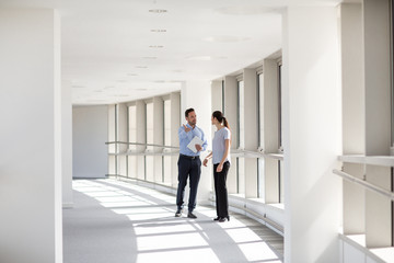 Businessman welcoming new employee to office