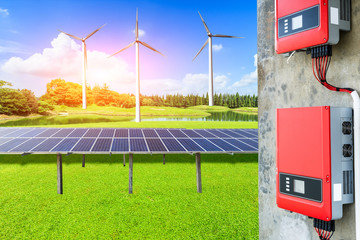 Wind generator and solar panel on green field,power control panels scene