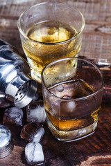 A glass of wine on a wooden table.