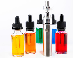 Electronic cigarette and bottles with vape liquid on white background