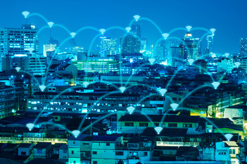 wifi connection over night modern city for technology background