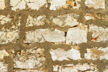 Old wall made of stone and concrete, background