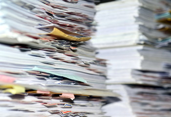 many paper files on the desk