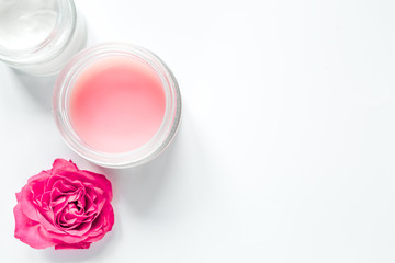 Nail care spa set with rose blossom, cream white background top view mockup