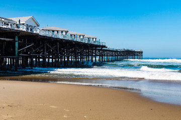 Pacific Beach in San Diego, California with vacation cottages on top of Crystal Pier.