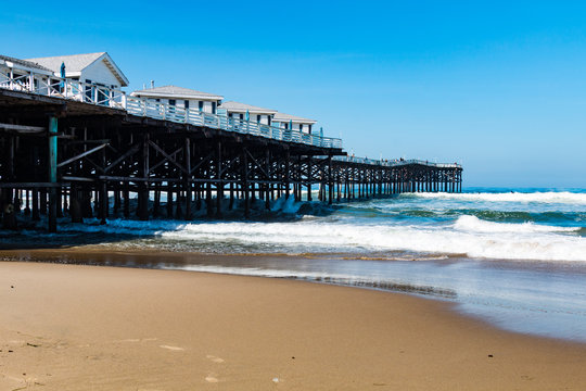 Pacific Beach in San Diego, California with vacation cottages on top of Crystal Pier.