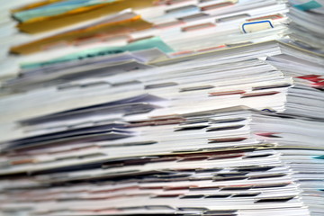 Many paper files on the desk