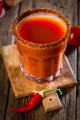 Glass of bloody Mary with chili