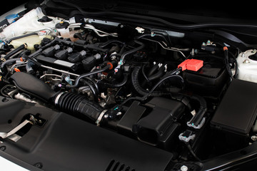 Fototapeta na wymiar Close up detail of new car engine The powerful engine of a car. Internal design of engine
