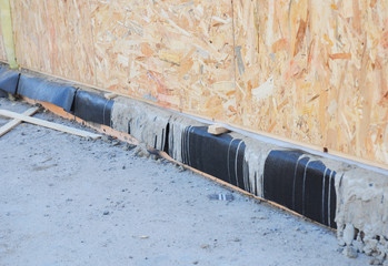 Waterproofing basement SIP panel walls. Sip House foundation waterproofing with bitumen membrane....