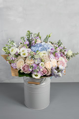 Still life with a bouquet of flowers. the florist put together a beautiful bunch of flowers. Man manual work used different types of flowers and colors. copy space