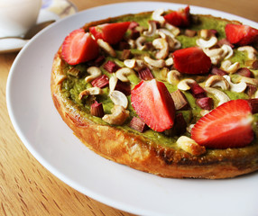 Matcha green tea cake with strawberry, rhubarb, Cashew nuts