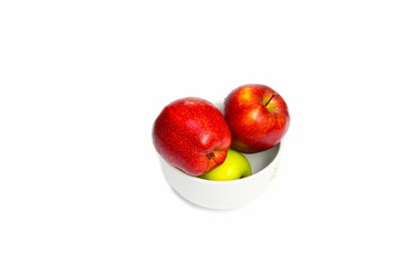 apple red with  green  in bowl and water drip on white background