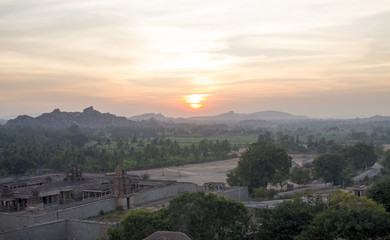 architecture ancient the city of Hampi in Indiaon a sunset
