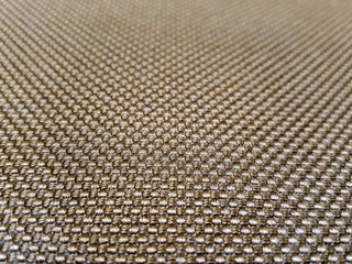 Close-up view of a woven fabric with a detailed texture and pattern, perfect for design or...