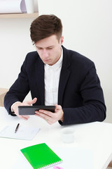 young man using a digital tablet