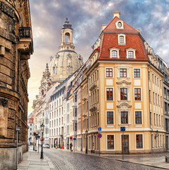 Fototapeta na wymiar A narrow street in the historic center of Dresden in the morning without pedestrians and cars