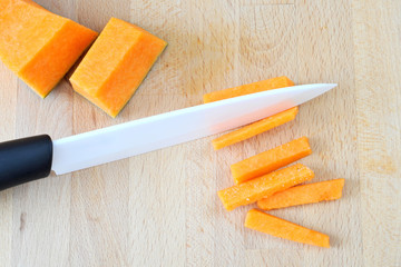 Background with ceramic knife and pumpkin, from above