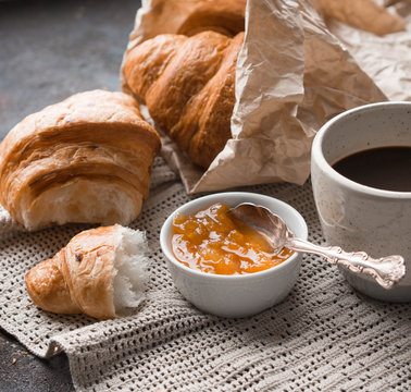 French breakfast - fresh croissants, apricot jam and coffee.

