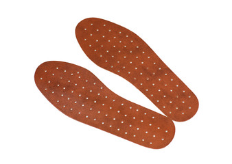 Pair of brown leather insoles on a white background